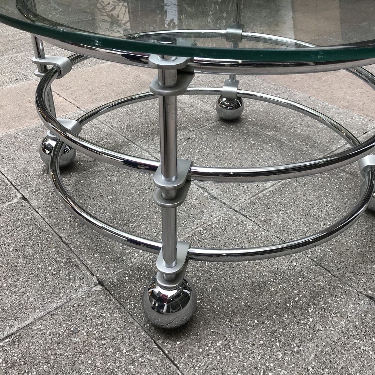 Table basse streamline inox et verre, circa 1970